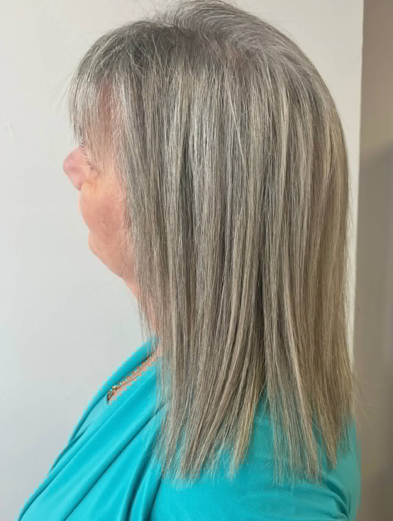 Silver and grey blended highlights on a sleek lob